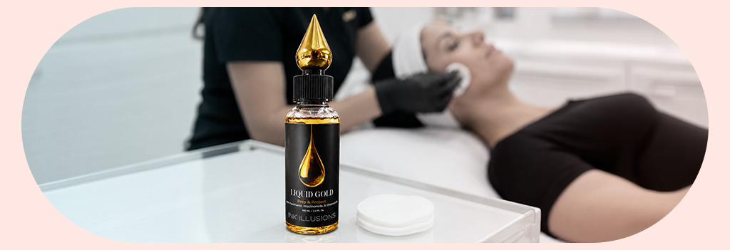 Liquid Gold - Skin Prep and Protect on a table next to cotton pads with someone using the product on a client.